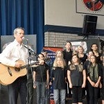 Col. Chris Hadfield plays the song, Is Somebody Singing, with students at École KLO Middle School. Photo credit: Paul Marck