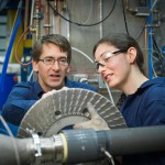 James Olson and Nici Darychuk examine a refiner plate to be used in a pilot scale experimental trial. Photo credit: Martin Dee